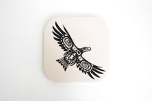 Load image into Gallery viewer, an off white coaster with a black formline design of Eagle Flying