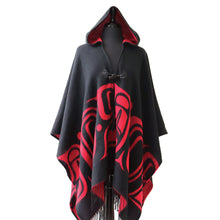 Load image into Gallery viewer, A black hooded Shawl draped over a dress form. The shawl has red formline designs alone the lower half and red lining. The shawl is closed by a toggle button. It has fringes along the bottom hem.