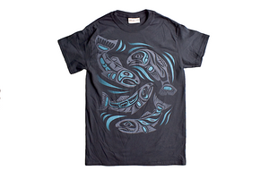 A black t-shirt with a formline design in various shades of blue. The design is of four Salmon swimming all posed differently. 