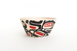 Small bamboo fiberware bowl with red and black raven design across one of its sides.